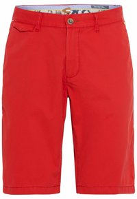 Shorts rouges en tissu léger avec une fermeture à bouton et des poches avant. L'intérieur est doublé d'un tissu à motif.