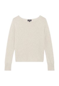 Maglione beige chiaro in morbido tessuto a maglia. Collo a barchetta, maniche lunghe con dettagli a bottoni ai polsini e una vestibilità rilassata. Leggera texture scintillante.