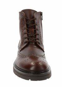 Stivale alla caviglia in pelle marrone con dettagli brogue, chiusura con lacci e cerniera laterale. Suola in gomma robusta con finitura testurizzata.