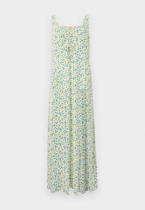 Vestido maxi amarillo sin mangas con pequeño estampado floral azul y detalle fruncido con lazo en el pecho, mostrado sobre un fondo liso.