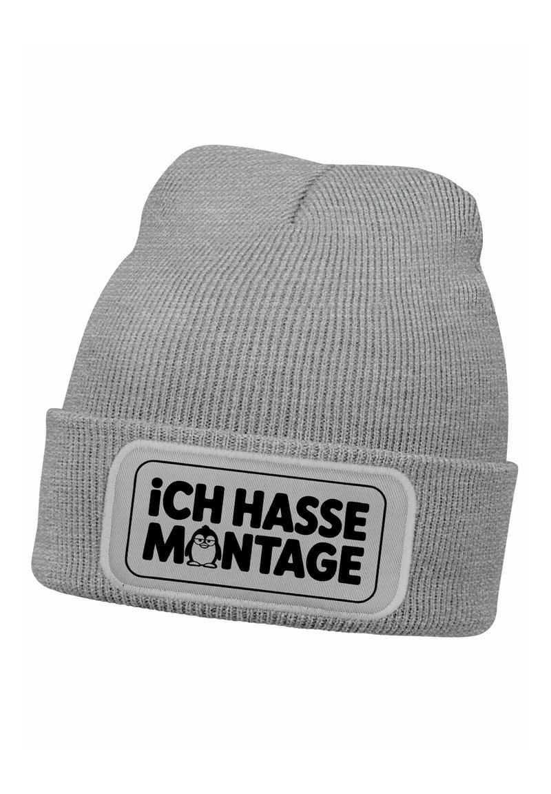 Gray knit beanie with a folded cuff, featuring a rectangular patch that reads "iCH HASSE MONTAGE" in black text and includes a cartoon penguin.