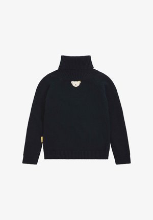 Suéter de punto azul marino con cuello alto. Presenta un diseño bordado de un oso en el pecho y una etiqueta amarilla en el lado. Corte clásico.