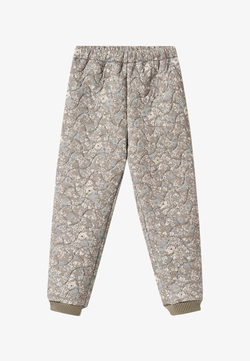 Pantalon matelassé avec taille et poignets élastiques, présentant un motif floral discret dans des tons beige et bleu clair.