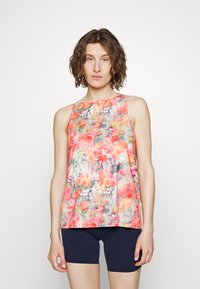 Top sem mangas floral com um padrão colorido em tons de rosa, laranja e cinza. Tecido leve e corte descontraído com decote redondo.