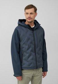 Granatowa pikowana kurtka z kapturem, zapinana na zamek, z kontrastowymi teksturowanymi rękawami.