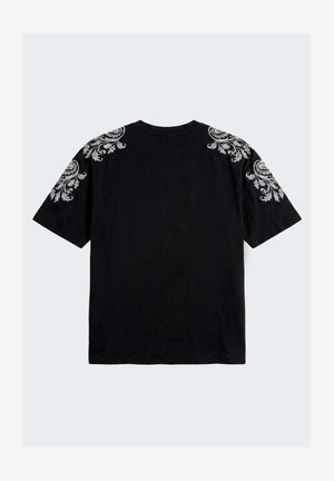 Black short-sleeve T-shirt with white intricate floral embroidery on shoulders and upper sleeves, shown from the back on a plain light background.