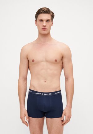 Marineblaue Boxershorts aus dehnbarem Stoff mit einem elastischen Bund, der das "JACK & JONES"-Logo in Weiß trägt. Glatte Textur.