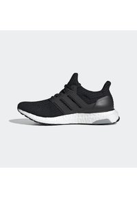 Chaussure de course noire en maille avec semelle blanche amortie et cage de soutien noire à trois bandes, vue de profil sur fond gris.