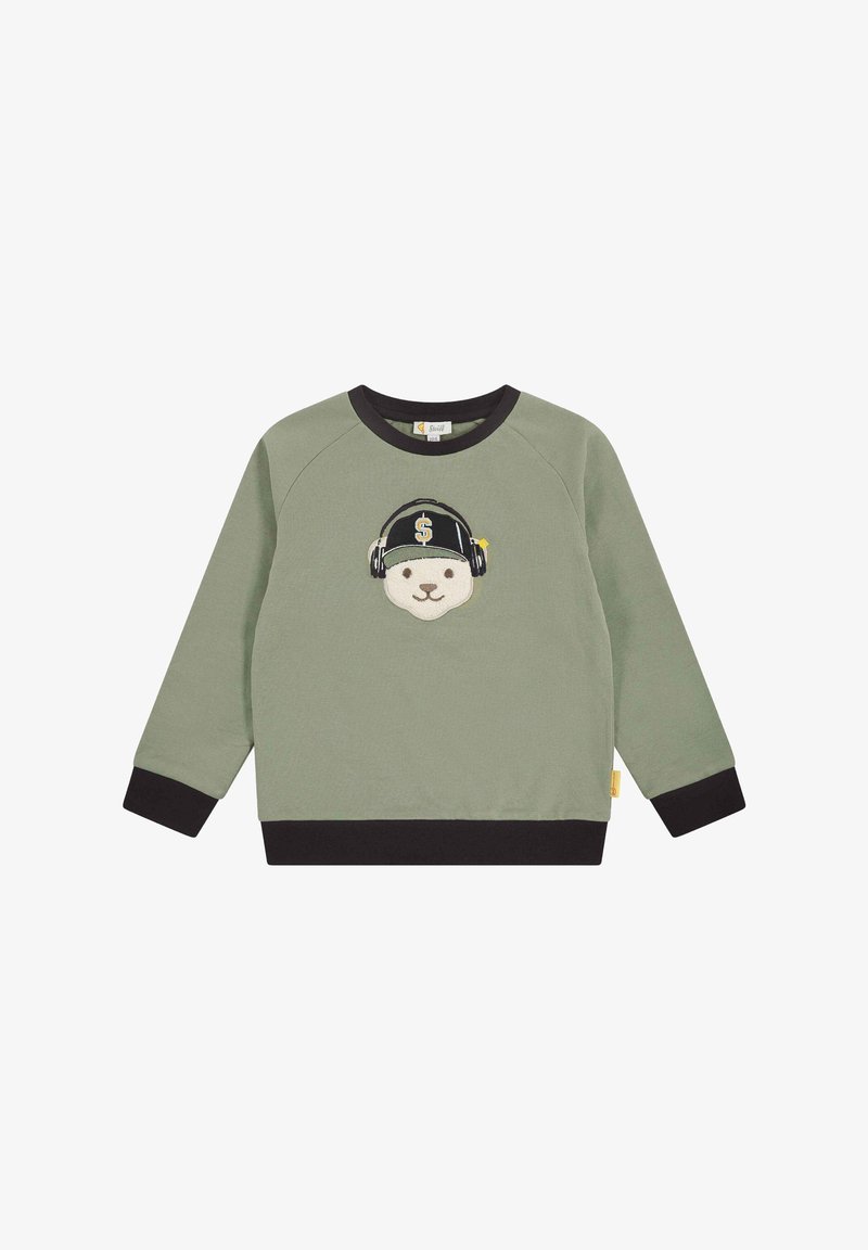 Sweat-shirt vert avec des poignets et un ourlet noirs, présentant le visage d'un ours avec des écouteurs et une casquette noire ornée d'un signe dollar.