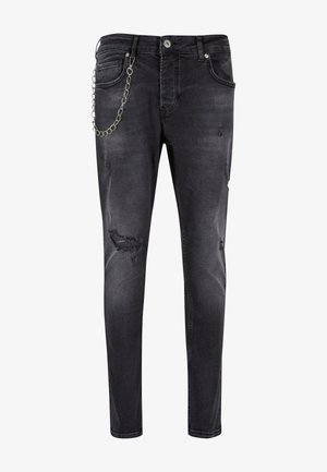 Zwarte denim jeans met een slim fit, voorzien van versleten delen en een zilveren kettingdetail aan de zijkant. Middenhoog taille met vijf zakken.