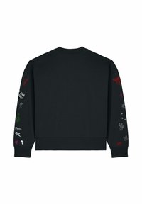 Sweat-shirt noir à manches longues avec de petits symboles colorés et du texte, comprenant un serpent, un cactus et des étoiles, imprimés le long des deux manches.