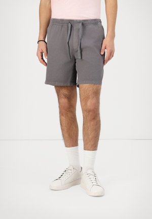 Graue Baumwollshorts mit elastischem Bund und Kordelzug, ausgestattet mit seitlichen Taschen und einem lässigen, lockeren Schnitt, in einer oberschenkellangen Länge.