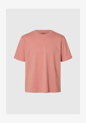 Lühikeste varrukatega t-särk heledas roosakas puuvillas, millel on ümara kaelusega ja lõdva lõikega disain. Pehme tekstuur ilma nähtavate mustrite või riistvaralisteta detaile.