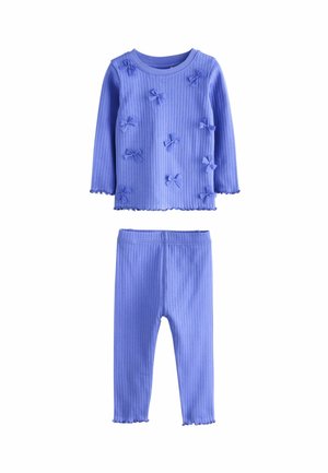 Two-piece children's outfit in ribbed purple fabric, featuring a long-sleeve top with bow accents and matching leggings with scalloped hems.