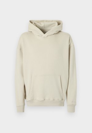 Bézs kapucnis pulóver puha anyagból. Elején kenguru zsebbel, bordázott mandzsettával és szegéllyel. Egyszerű, kényelmes kialakítás.