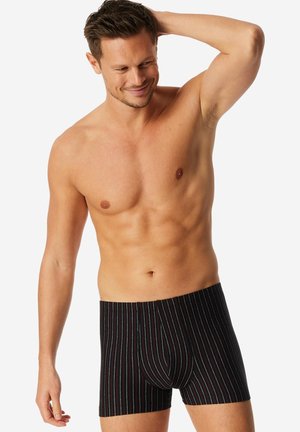 Schwarze Boxer-Shorts mit mehrfarbigen vertikalen Streifen, mit enger Passform und einer konturierten Tasche für Halt. Weiches Baumwollmaterial.