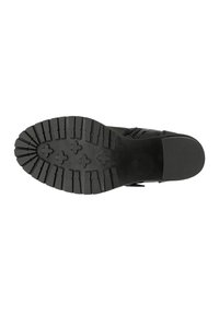 Stivaletto nero con suola in gomma testurizzata, dotato di scanalature profonde per una migliore aderenza. Progettato con una parte superiore liscia e una cerniera laterale per una facile indossabilità.