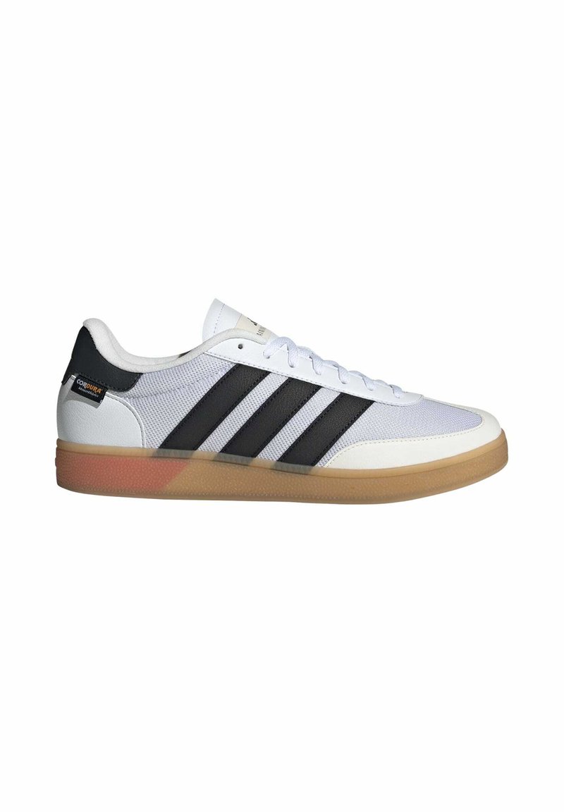 White athletic shoe with black stripes, synthetic mesh upper, rubber gum sole, flat laces, and a small logo on the heel.
