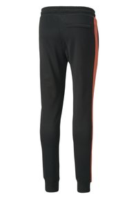 Black jogger pants with a tapered design, featuring a vibrant orange side stripe and an elastic waistband. Includes a back pocket detail.