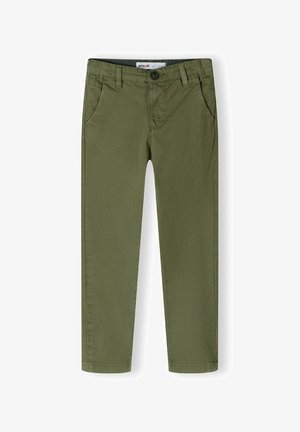 Pantalons slim en olive en tissu de coton, avec poches avant et fermeture à bouton. Texture lisse, design épuré.