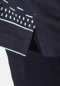 Navy t-shirt featuring a textured finish with light blue graphic accents, including horizontal and vertical patterns near the hem and sleeves.