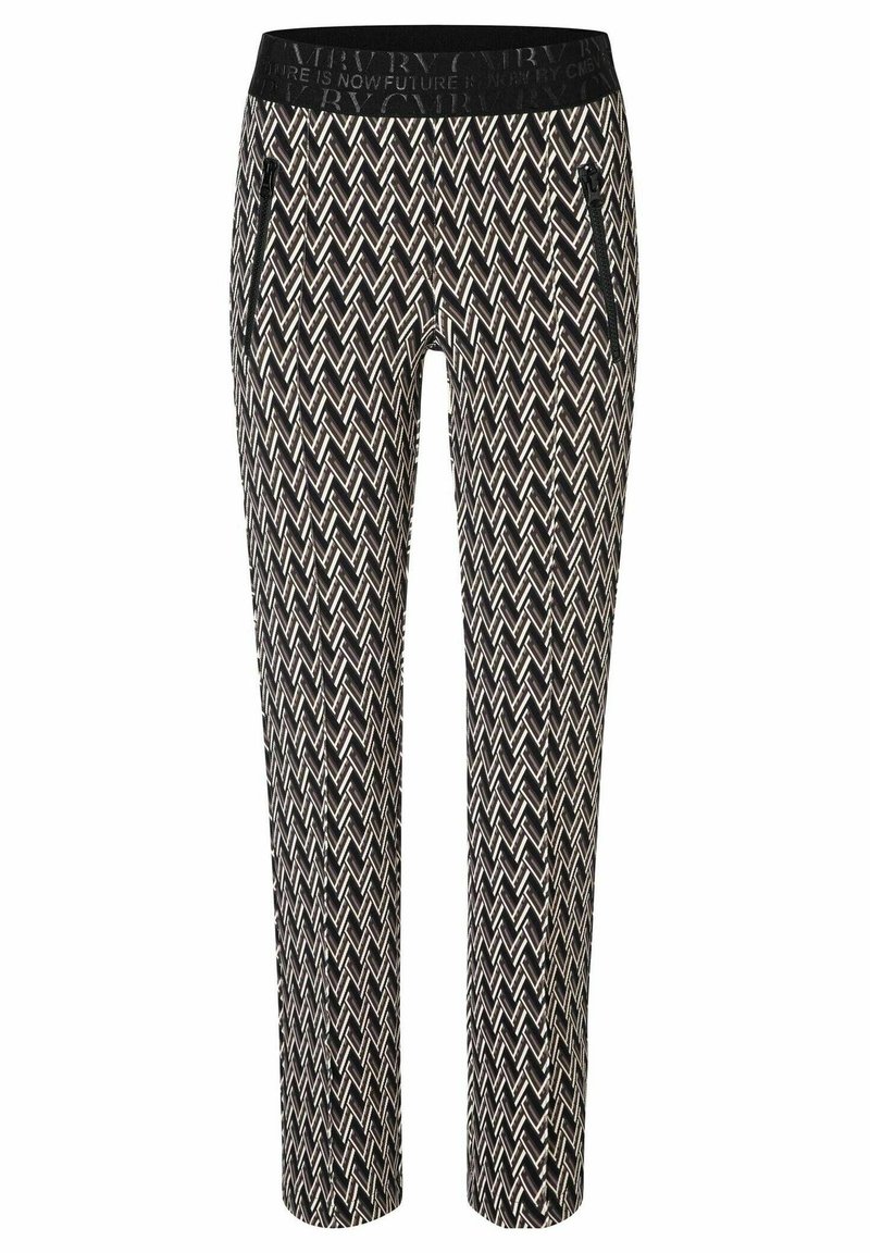 Pantalon à motifs noirs et blancs avec un design en chevrons, taille élastique et poches latérales zippées. Coupe slim avec une jambe fuselée.