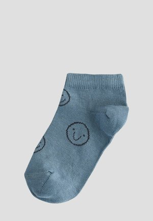 Chaussette en coton bleu clair avec motif de smiley, bord côtelé et pied renforcé. Texture douce, adaptée à un port décontracté.