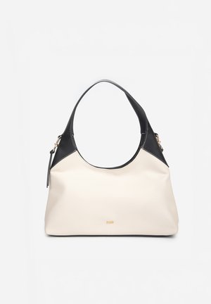 Sac à main crème avec poignées et accents noirs, taille moyenne, avec un logo doré « RAID » au centre devant.