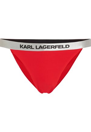 Raudonos maudymosi kelnaitės su juodu ir sidabriniu elastingu juosmeniu, ant kurio ryškiai išspausdinta "KARL LAGERFELD". Lygus tekstūros ir prigludusio dizaino.
