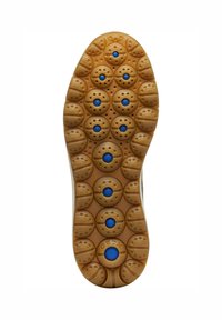 Soletta della scarpa in gomma beige con fossette circolari e piccoli accenti blu. Include fori di ventilazione e logo del marchio. Superficie testurizzata.