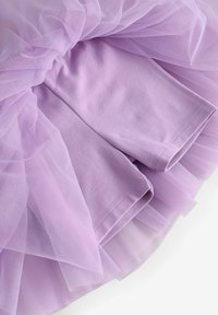 Soft lavender tutu skirt with layered sheer tulle over matching cotton shorts underneath, arranged flat on a white background.