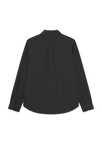Black long-sleeve shirt made of textured fabric. Features a classic collar, buttoned cuffs, and a pleat at the back for added detail.