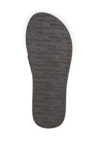Black insole with a textured surface, featuring repeated "Marc O'Polo" branding printed in a contrasting color. Smooth edges and rounded toe.
