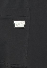 Antony Morato TROUSERS SUPER IN STRETCH TERRY - Calças de fato de treino - black