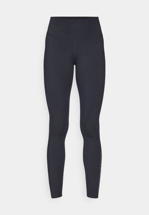 Czarne legginsy z wysokim stanem wykonane z elastycznego, gładkiego materiału. Posiadają boczne szwy i subtelną logo na dolnej części nogi.