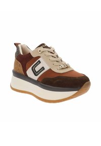 Zapatilla marrón y beige con un upper texturizado, acentos en negro, detalles de purpurina y una suela blanca gruesa. Presenta un diseño de cordones.