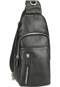 Sac en cuir noir en bandoulière avec surface texturée, comprenant un compartiment principal zippé, une poche zippée supplémentaire à l'avant et des accents en métal.