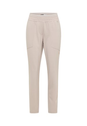 Pantalon beige clair ajusté avec taille élastique et poches avant, conçu pour un usage décontracté ou actif.