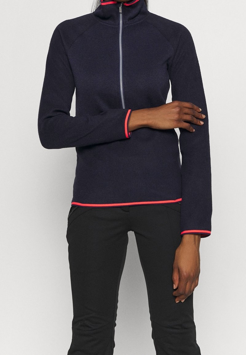Marine fleece longsleeve top met hoge kraag, frontrits en roze rand op de kraag en manchetten. Glad textuur, aansluitend ontwerp, geen patronen.