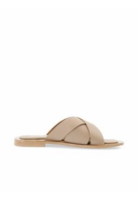 Infradito beige con fasce incrociate realizzate in materiale liscio. Suola in legno piatta, design minimalista e stile open-toe.