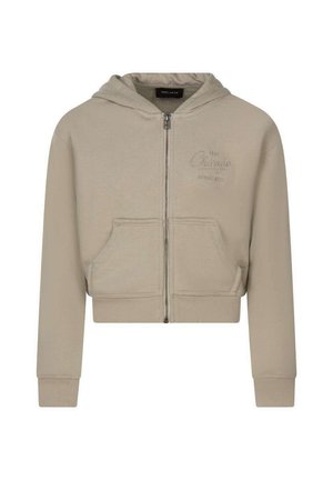 Sweat à capuche beige avec fermeture éclair, poches devant, manches longues, capuche et texte "Chicago" discret brodé sur le côté gauche de la poitrine.