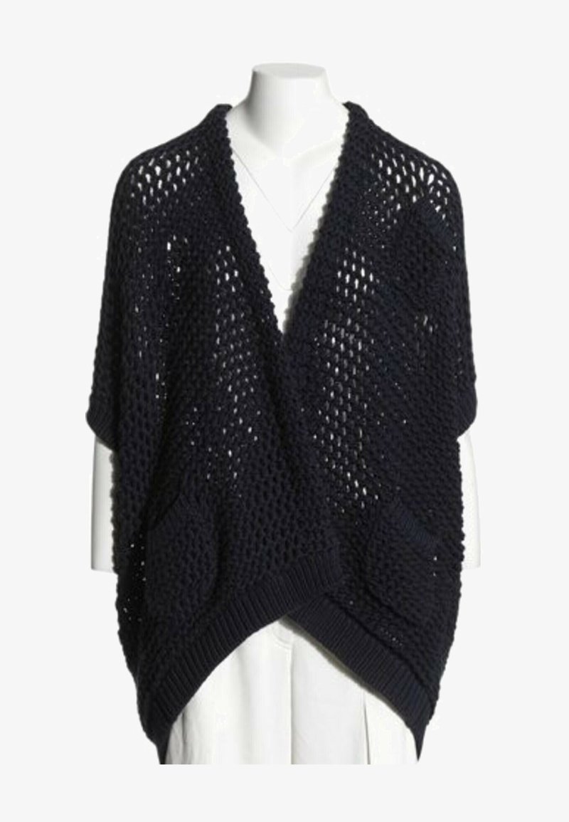 Cardigan noir à maille ample devant ouvert, présenté sur un buste de mannequin blanc portant un haut blanc.