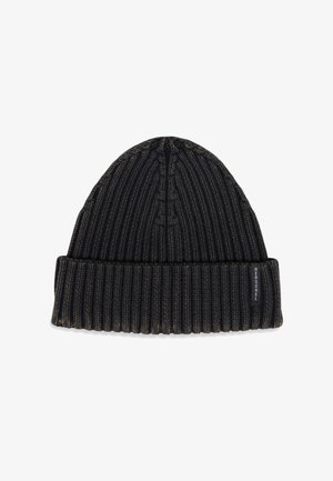 Black knit beanie with ribbed texture, featuring a folded cuff and a small woven logo label on the side. Soft, stretchy material.