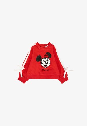 Felpa rossa a maniche lunghe per bambini con strisce bianche, dettagli a fiocco sulle maniche e una faccia di Minnie Mouse in paillettes sul fronte.