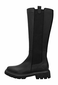 Botas negras hasta la rodilla con cuero suave y paneles laterales elásticos, con una suela de goma texturizada para mayor agarre y una lengüeta en la parte superior.