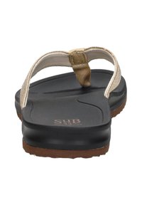 Brown rubber sole flip-flop with a textured black footbed, beige woven strap, and a tan accent above the toe post.