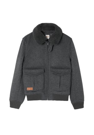 Veste en laine grise avec un col en fausse fourrure, fermeture éclair à l'avant, deux grandes poches poitrine et poignets côtelés. Elle présente un patch en cuir de la marque en bas.