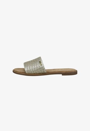 Slide sandal with a woven silver upper, padded footbed, and tan outsole. Minimalist design featuring a wide strap for comfort.
