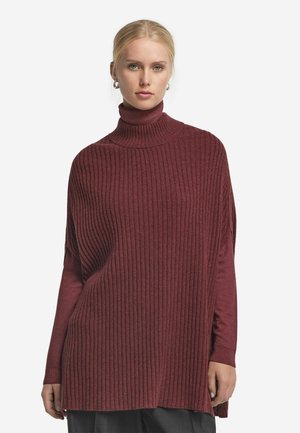 Bordeaux geribbelde coltrui met lange mouwen, textuurstof, losse pasvorm en zijsplitten voor extra comfort. Ideaal voor lagen.