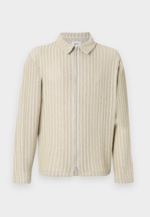 Světle žlutá a krémová pruhovaná zipová bunda s límcem, dlouhými rukávy a texturovaným pleteným vzorem. Obsahuje přední zipové zapínání.